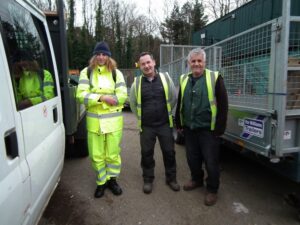 Photo of three participants onsite Llun o dri o gyfranogwyr ar y safle